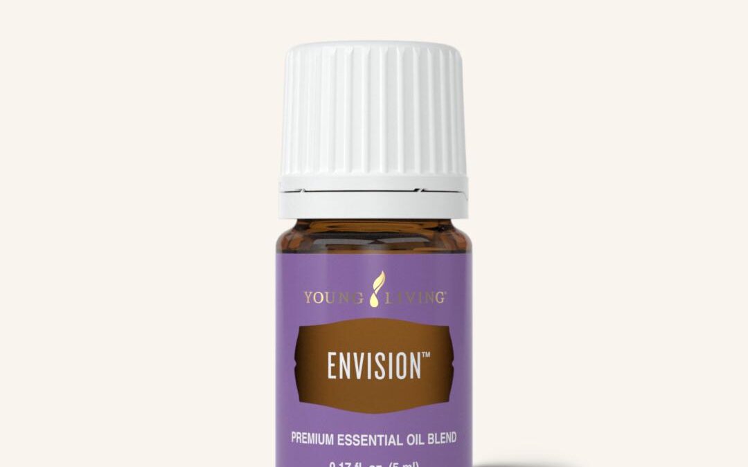 Brown bottle of Young Living Envision essential oil with a purple label and white cap.