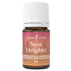 A small brown bottle of Young Living New Heights essential oil with a white cap and a pink and orange label.