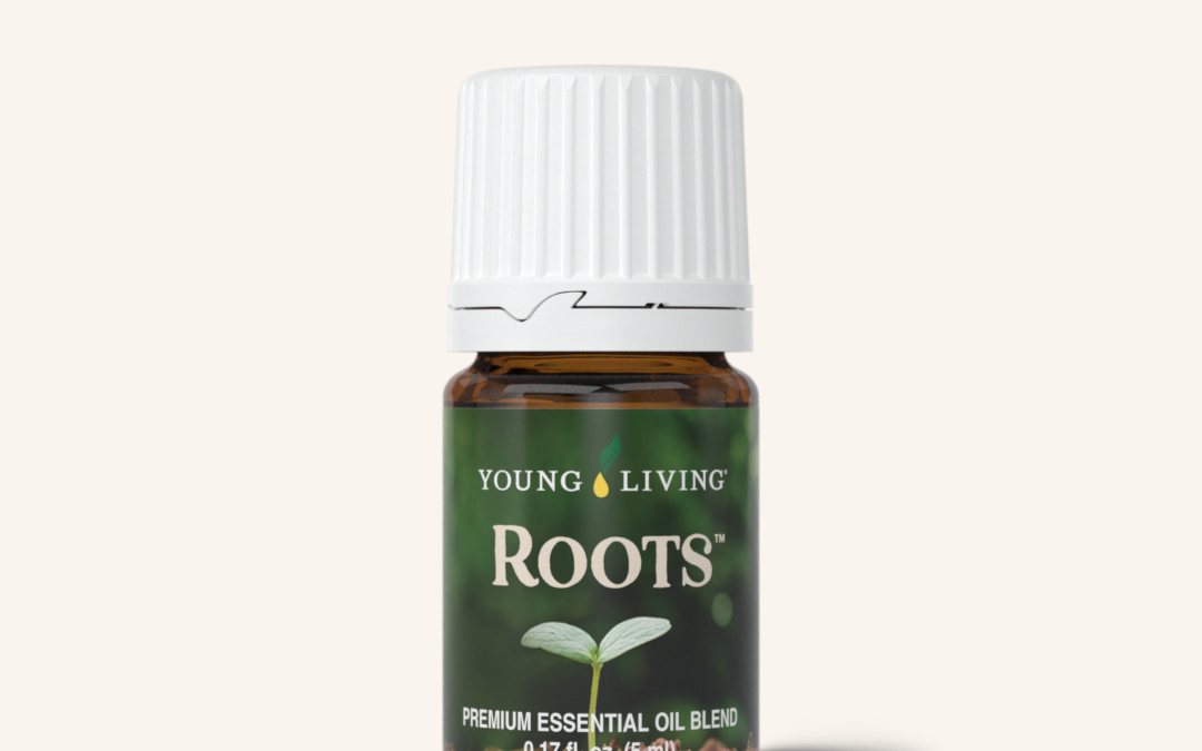 Small brown bottle of essential oil with a white lid, green label with a root sprouting and the word "Roots."